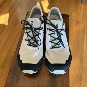 On Running White and Black Athletic Shoes with Cushioned Midsole